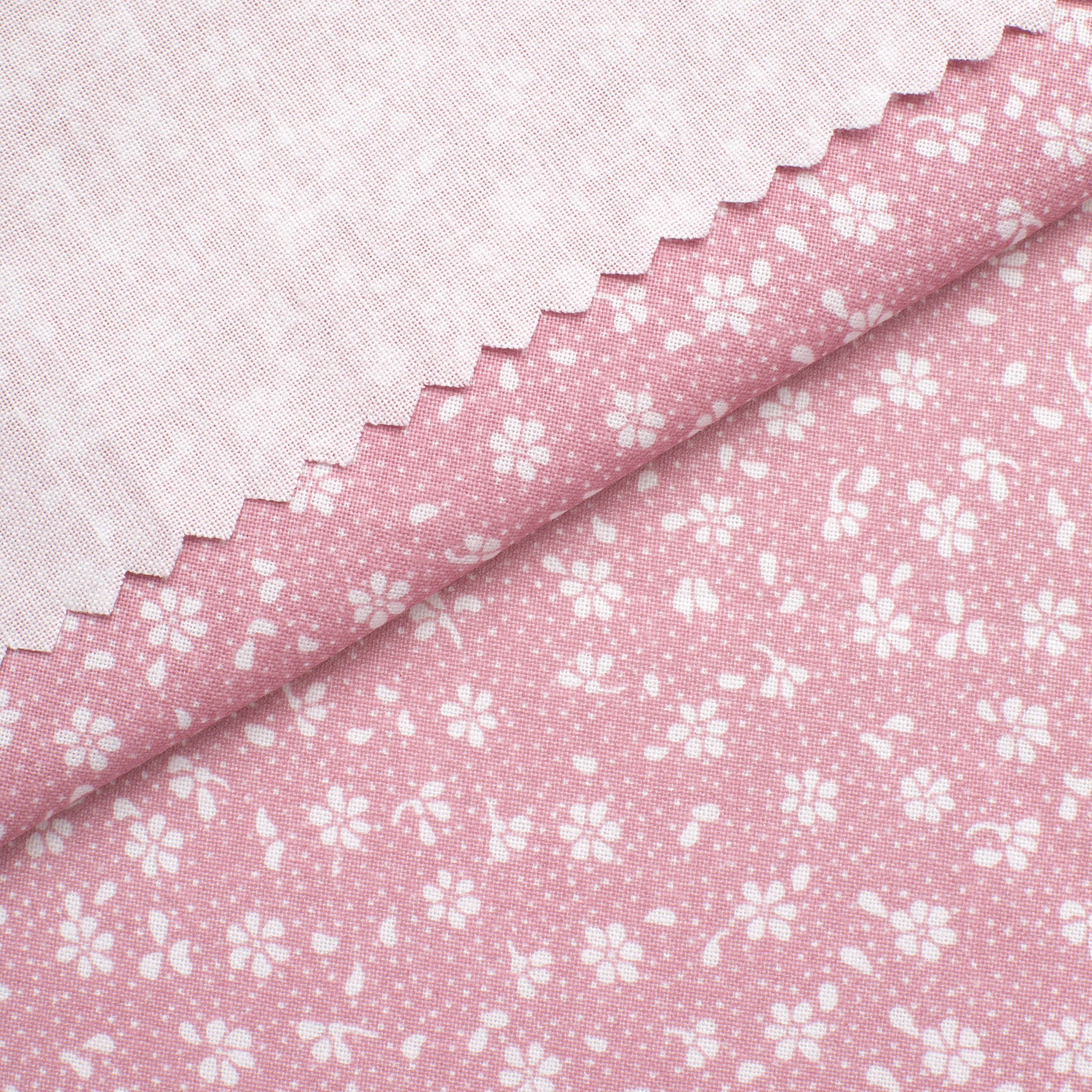 PRINTED COTTON POPLIN FABRIC - SMALL WHITE FLOWERS ON PINK BACKGROUND - 160 GSM