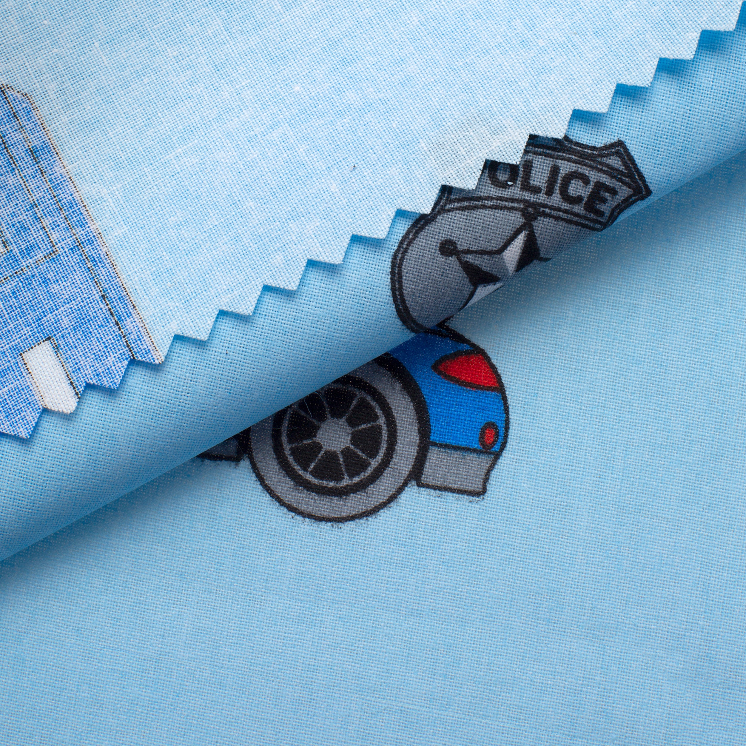 PRINTED COTTON POPLIN FABRIC - POLICE VEHICLES ON BLUE BACKGROUND - 160 GSM