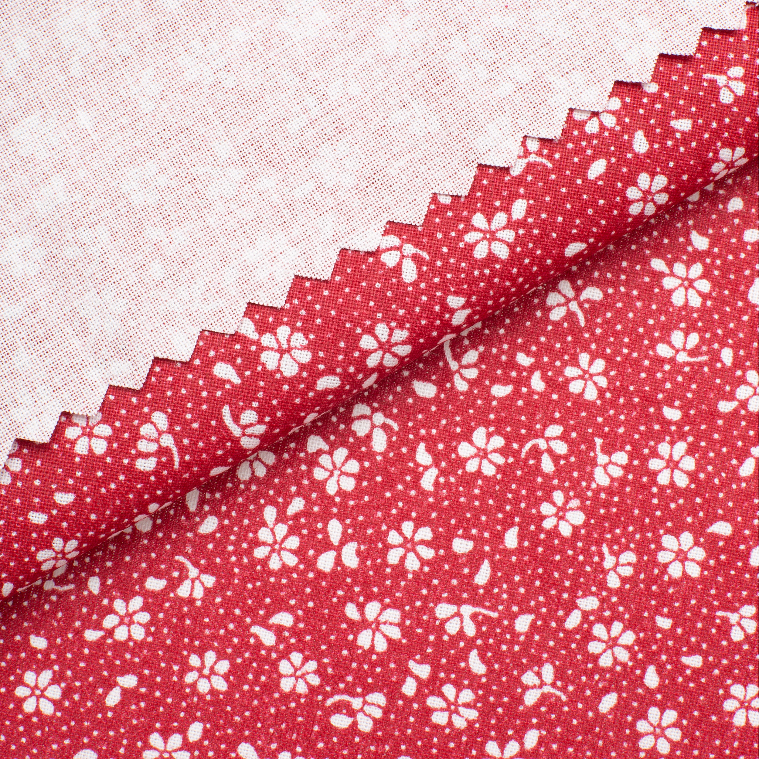 PRINTED COTTON POPLIN FABRIC - SMALL WHITE FLOWERS ON RED BACKGROUND - 160 GSM