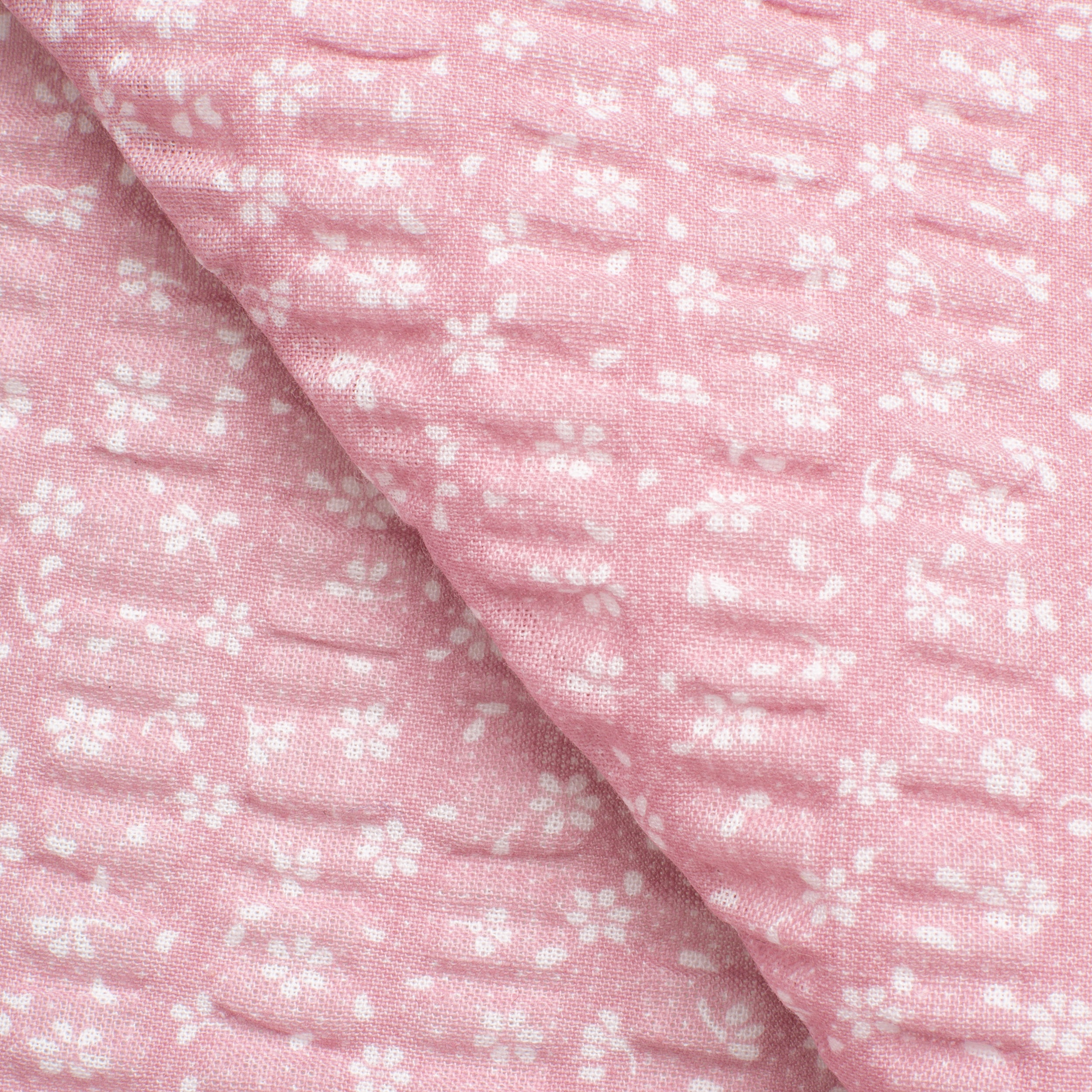 PRINTED COTTON SEERSUCKER FABRIC - SMALL WHITE FLOWERS ON PINK BACKGROUND - 160 GSM