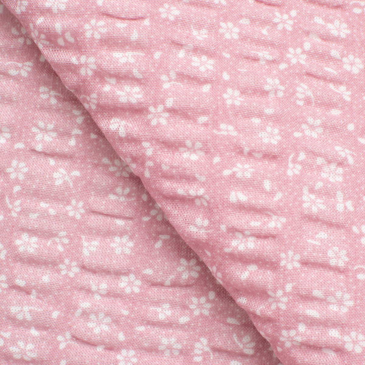 PRINTED COTTON SEERSUCKER FABRIC - SMALL WHITE FLOWERS ON PINK BACKGROUND - 160 GSM