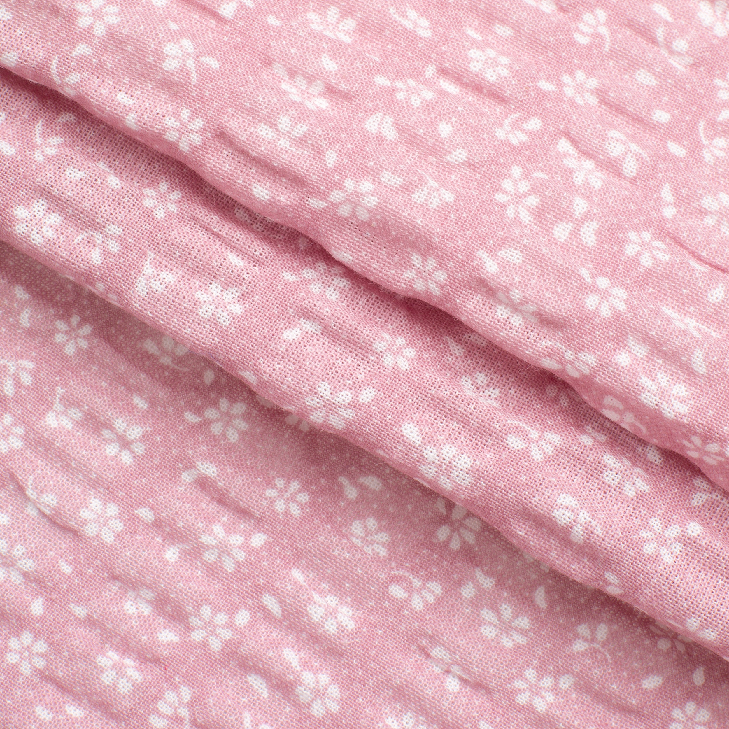 PRINTED COTTON SEERSUCKER FABRIC - SMALL WHITE FLOWERS ON PINK BACKGROUND - 160 GSM